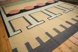 Hand woven Indian Contemporary Kilim with beige, black, and blush interlocking geometric patterns.
