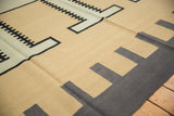 Hand woven Contemporary Kilim rug showing abstract interlocked beige, black, and dark gray pattern.