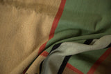 Hand woven contemporary Kilim rug texture with beige, mallard green, cherry red, and black.