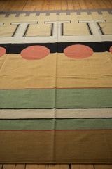 Vintage Indian Kilim detail: abstract geometric circles, mallard green, cinnabar red stripes.
