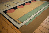 Bold geometric pattern of vintage Indian Kilim with cinnabar red circles and mallard green.