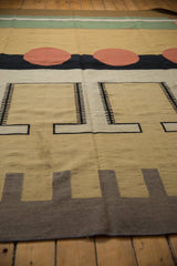 Abstract contemporary Indian Kilim rug section with beige, black, and cinnabar geometric motifs.