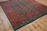 Intact ivory fringe and original side cord selvage on a vintage hand-knotted Pakistani carpet.