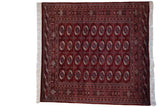 Vintage Pakistani Bokhara square rug with a repeating gul pattern in maroon red, navy blue, and ivory.