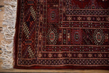 Detailed borders, intact side selvedge, and ivory fringe on a vintage Pakistani Bokhara rug.