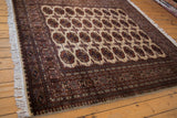 Lustrous wool pile and intricate geometric border on a fine Pakistani Bokhara design carpet.