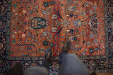 Vintage Indian Bijar rug with rust field, gul ferang motifs, and navy vine border.