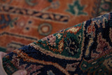 Dense, hand-knotted pile with rust, navy, green scrolling floral motifs.