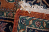 Rust side cord selvage, cream fringe, and mallard green floral border of vintage Bijar rug.