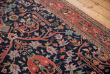Vintage Bijar design: navy blue field, gul ferang scrolling florals, meandering vine border.