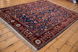 Angled view of a fine vintage Russian rug with an intricate Herati pattern and samovar turtle border.