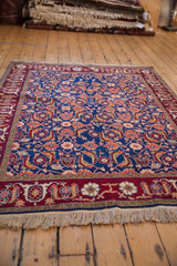 Low angle view of a vintage Russian Bijar rug, showcasing its dense wool pile and traditional Herati pattern.
