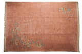 Vintage Japanese Art Deco carpet with a plush, open field in dusty rose and sprawling floral corners.