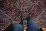 Thick plush pile with diamond medallion and Herati motif on a vintage Indian Bijar carpet.