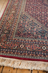 Vintage Indian Bijar carpet border, plush pile, raspberry, navy, terracotta, ivory fringe.