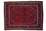 Vintage Persian Engelas rug with an allover Herati design in cherry red, navy blue, and ivory.