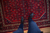 Plush, full pile and Herati motif of a vintage Engelas rug in cherry red and navy.