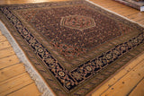 Vintage Ardebil rug corner with navy vine, turtle main border, apricot Herati field.