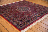 Thick plush pile and clear Herati motif on vintage Indian Bijar rug's raspberry field.