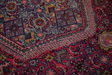 Detailed Herati motif on thick plush pile in raspberry red and slate blue.