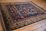 Vintage Indian rug with a geometric Shiraz design, shown in full from a low corner angle.