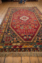 Hand-knotted vintage Indian Shiraz design carpet fringe with cherry red, gold geometric border.