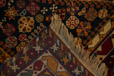 Intricate hand-knotted back and fringed edge of the vintage Indian Shiraz carpet.