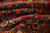 Richly colored folds of a vintage Afshar design carpet show its dense, hand-knotted pile.