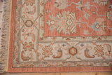 Indian Mahal hand-knotted rug border detail: dusty rose, ivory, slate blue floral motifs and fringe.
