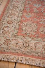Fringe and ivory border with seafoam accents on a hand woven Indian Mahal rug.