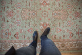Hand woven Indian Mahal carpet, seafoam field with terracotta and slate blue bursting floral palmettes.