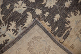 Corner view showing the hand-knotted foundation and intact selvage of a Peshawar rug.
