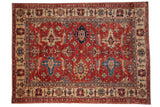 Pakistani Caucasian hand-knotted carpet, cherry red field, sapphire blue palmettes.