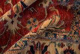 Lustrous hand-knotted wool pile reveals cherry red and sapphire geometric Caucasian design.