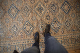 Kazak-inspired geometric rug pattern in rich blue and beige tones with fine abrashes.