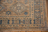 Hand-knotted detailed geometric blue and beige patterns with short fringe.