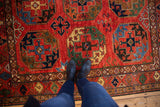Bold geometric Ersari design in cherry red, sapphire blue, emerald green wool pile.