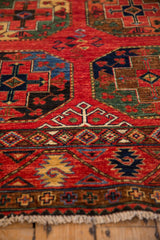 Intricate geometric border and field pattern on the cherry red Ersari design rug.