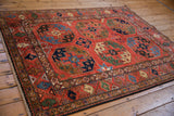 Hand knotted Pakistani Ersari design rug with rich gem tones and bold geometric palmettes.