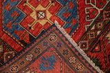 Close-up of Ersari design rug showing white fringe, dark selvage, and red, blue, brown border.
