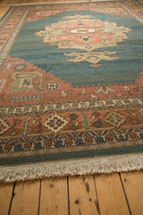 Vintage Indian Soumac rug's natural fringe and terra cotta serrated leaf border detail.