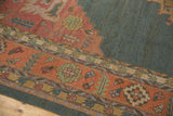 Vintage Indian Soumac rug border with terra cotta serrated leaf and geometric floral motifs.