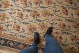 Allover vintage Serapi floral pattern in antique ivory, dusty terra cotta, and navy.