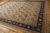 Vintage Serapi Indian Soumac carpet, navy blue floral border and antique ivory field.