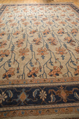 Navy blue border and terra cotta floral vinery on this vintage Indian Soumac carpet.