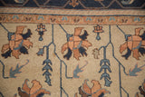 Hand-knotted Soumac rug, terra cotta floral petals and blue vinery on beige.
