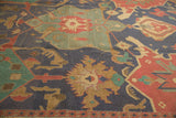 Large geometric Samovar outlines with lotus and dragon motifs on vintage Indian Soumac rug.