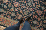 Intricate vinery and palmette motifs on the vintage Indian Soumac rug, dusty navy and blush.