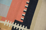 Stepped geometric design in madder red, jet black, sand on Contemporary Kilim.