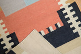 Hand woven contemporary Kilim rug, showing beige reverse, side selvage, and madder root red pattern.